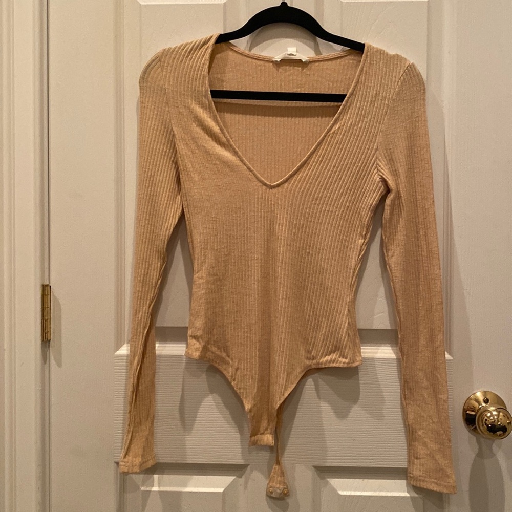 Bodysuit by Honey Punch. Size Medium. Never been worn. No tags